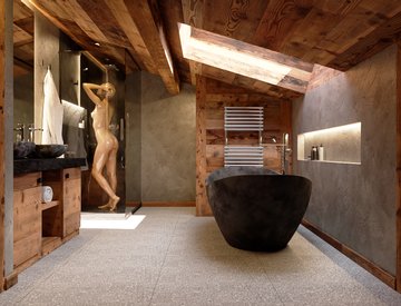 bathroom with stone and old wood